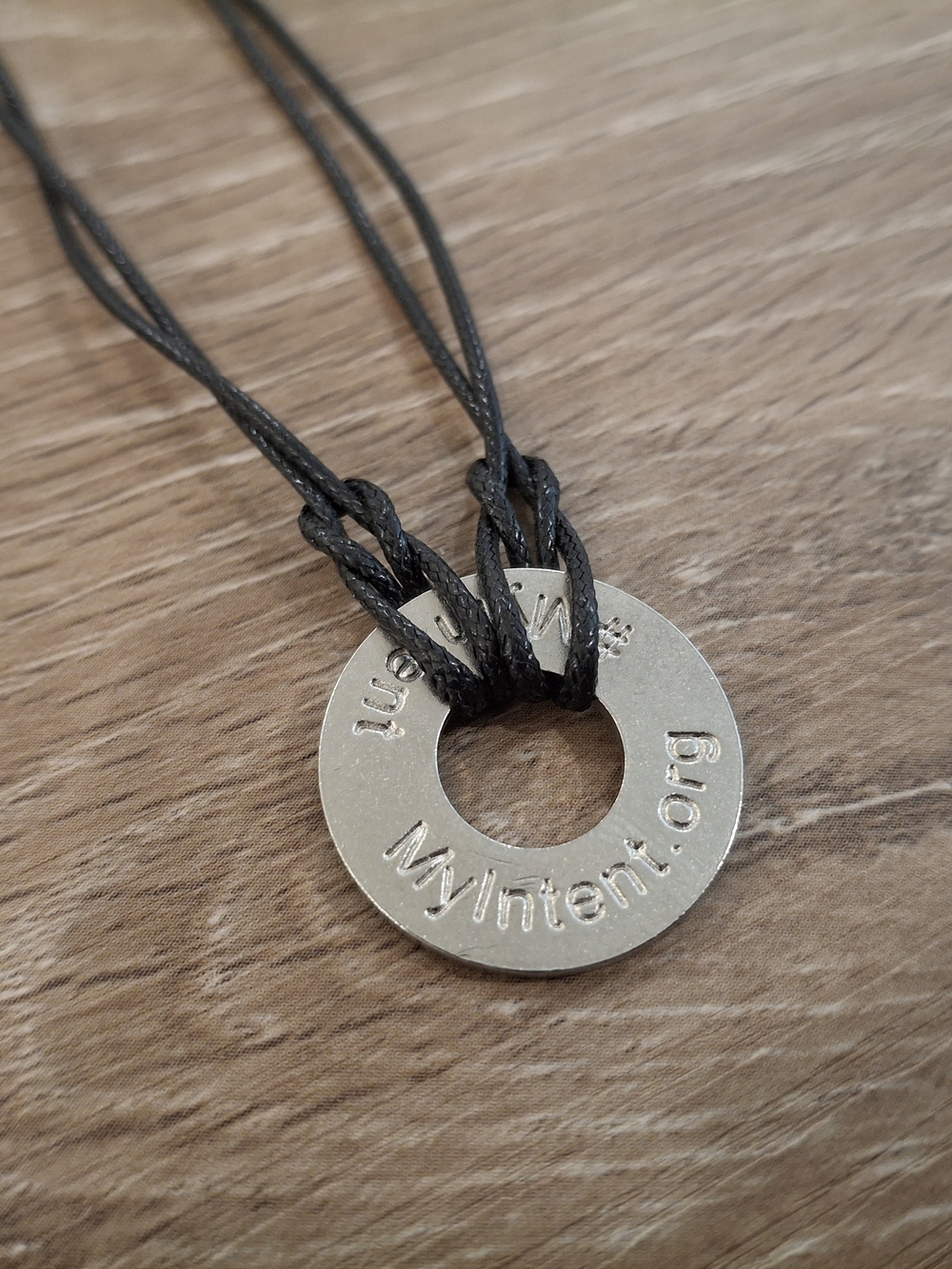 MyIntent Just Breathe Stamped Token Black Cord Adjustable Bracelet